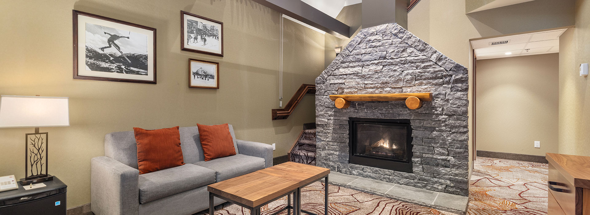 Corner loft suite with fireplace and seating area